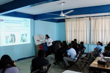 instructor teaching in front of a classroom